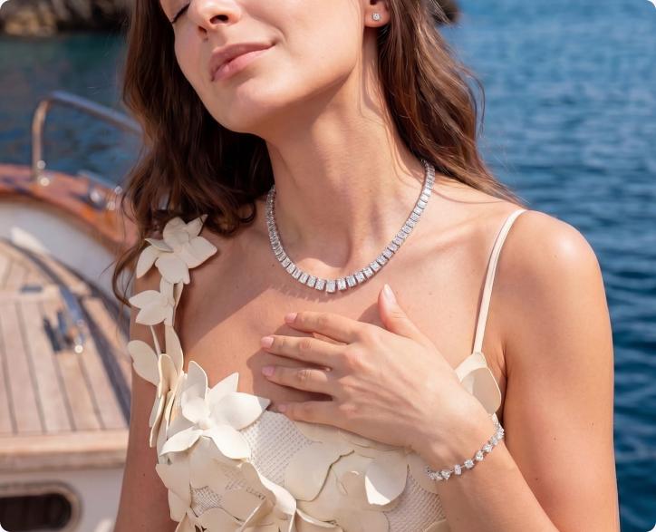 Model wearing a diamond necklace and bracelet